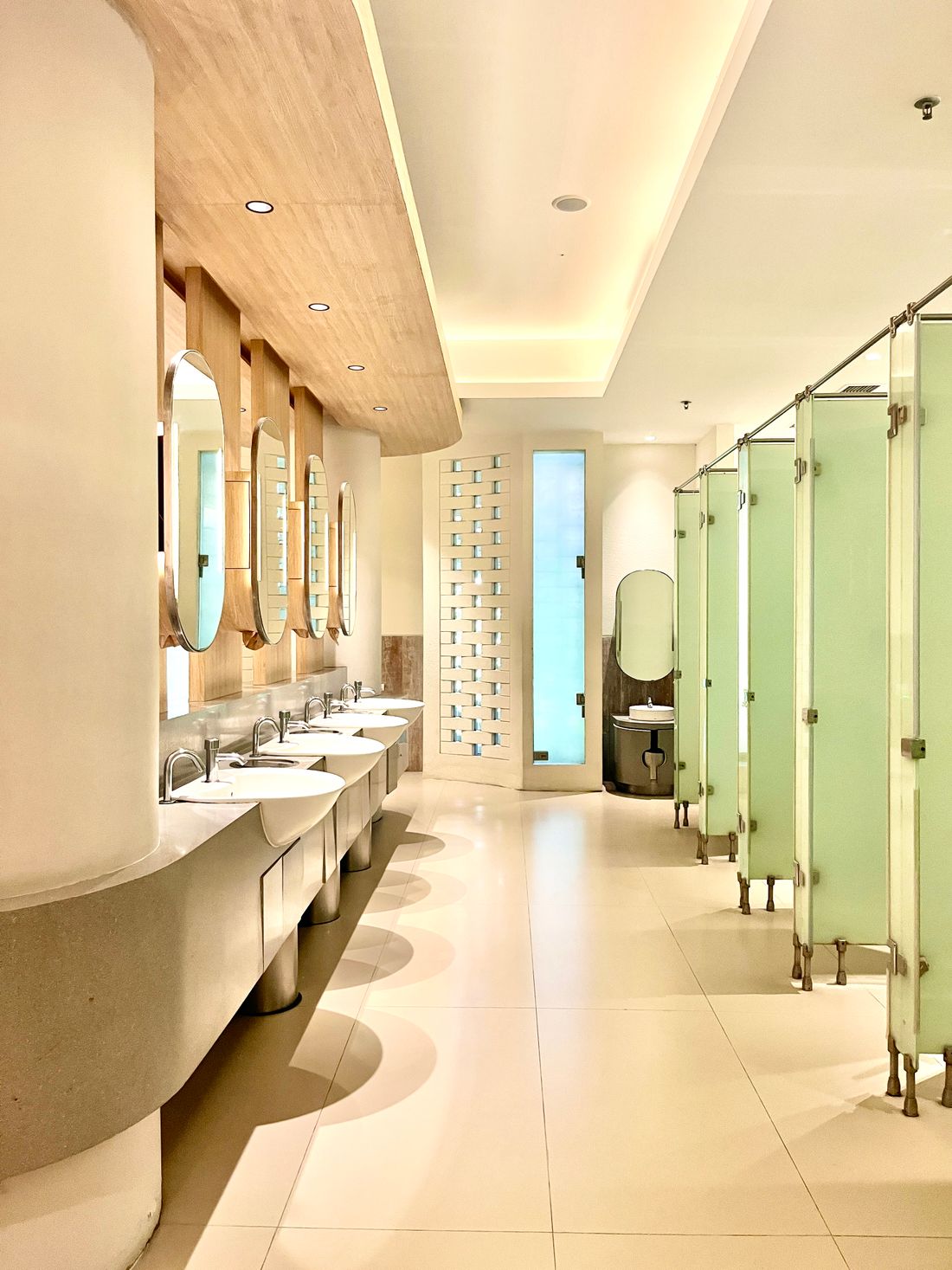 Campus washroom with a row of sinks and mirrors